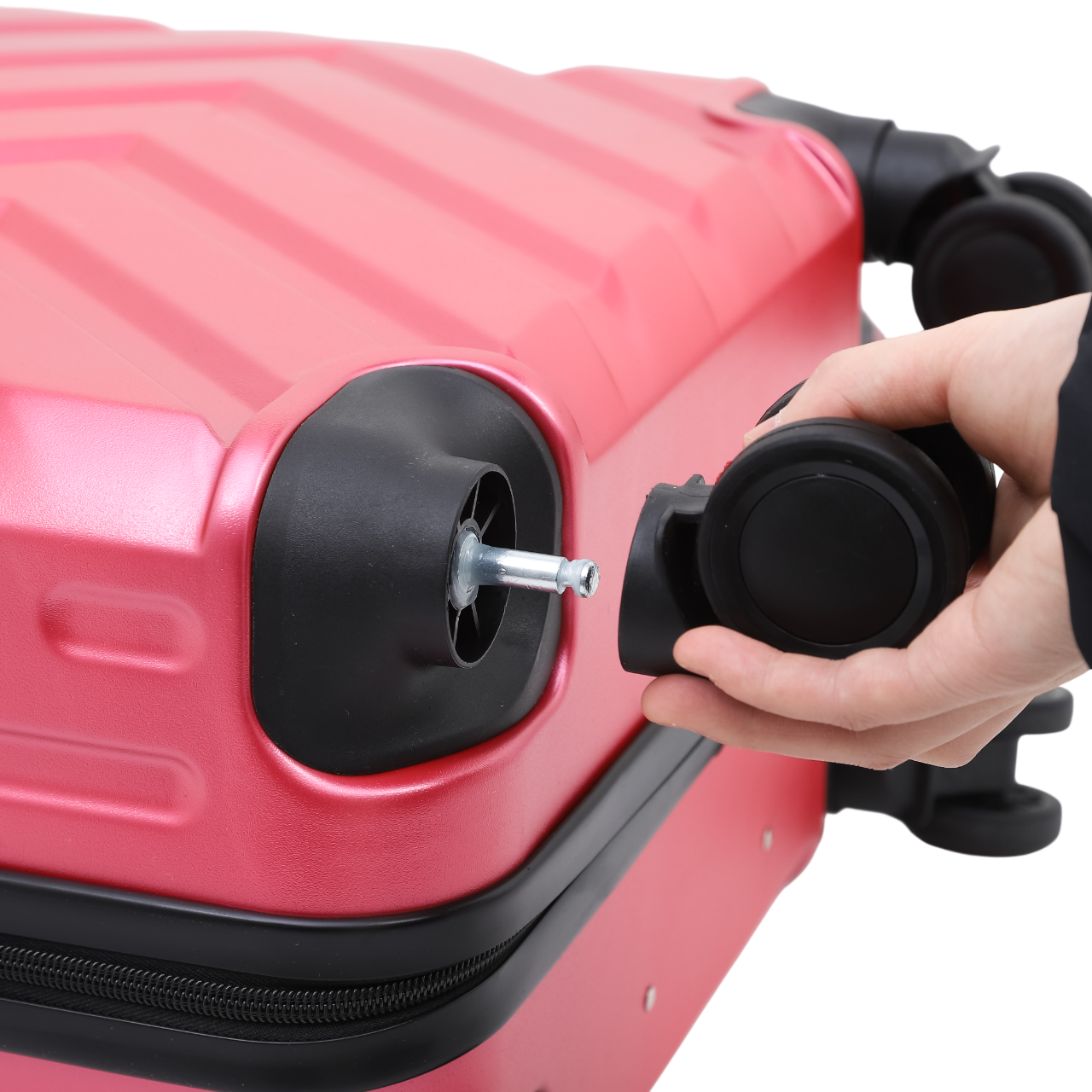 Nomado Horizon 2.0 lyserød kuffert med aftageligt hjul system til vedligeholdelse.